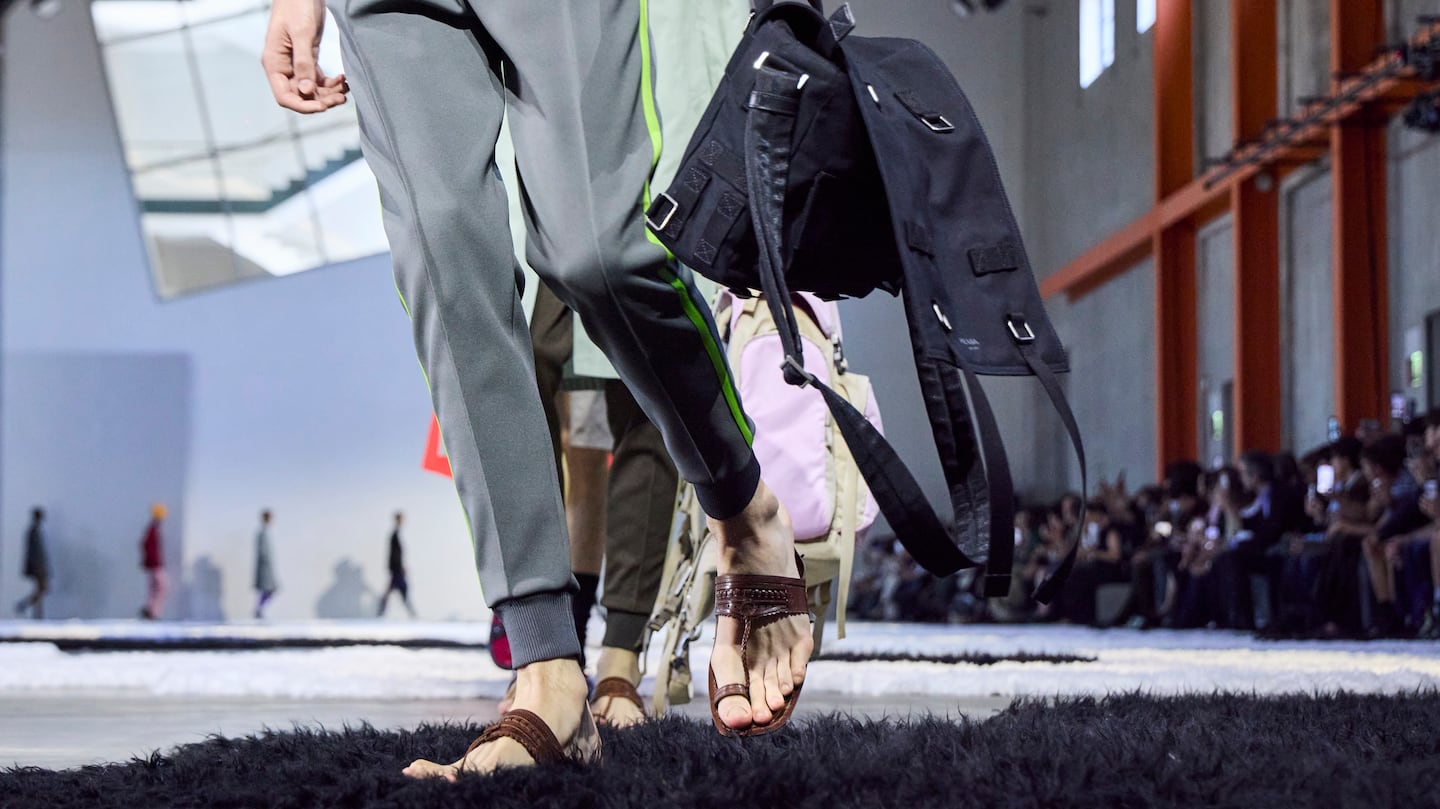 A model, shoe and bag detail, walks the runway at the Prada fashion show during the Milan Menswear Spring/Summer 2026 Fashion Week on June 22, 2025 in Milan, Italy.